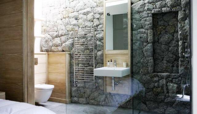Green Point - Completed residence Stone walled bathroom